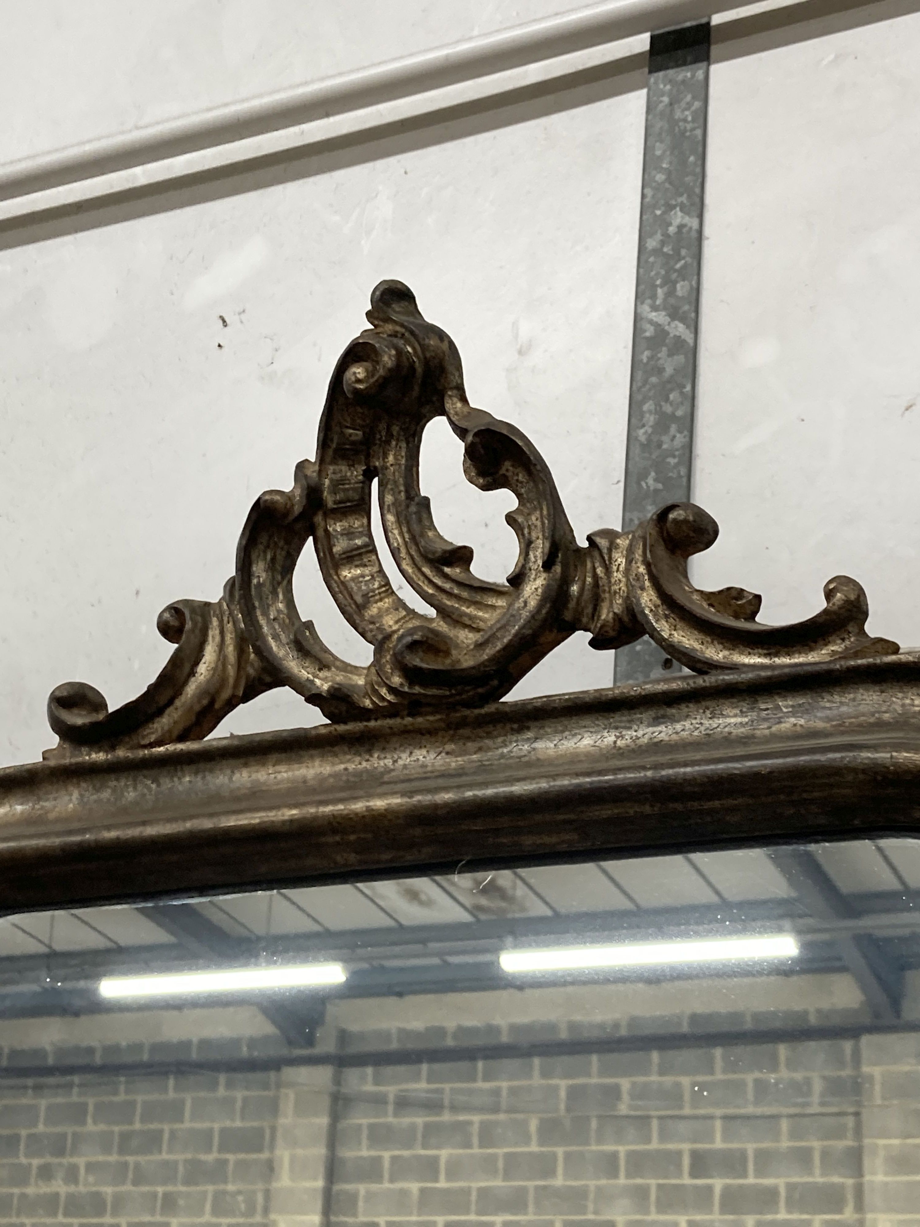 A French giltwood wall mirror with pierced scroll pediment, width 66cm, height 90cm